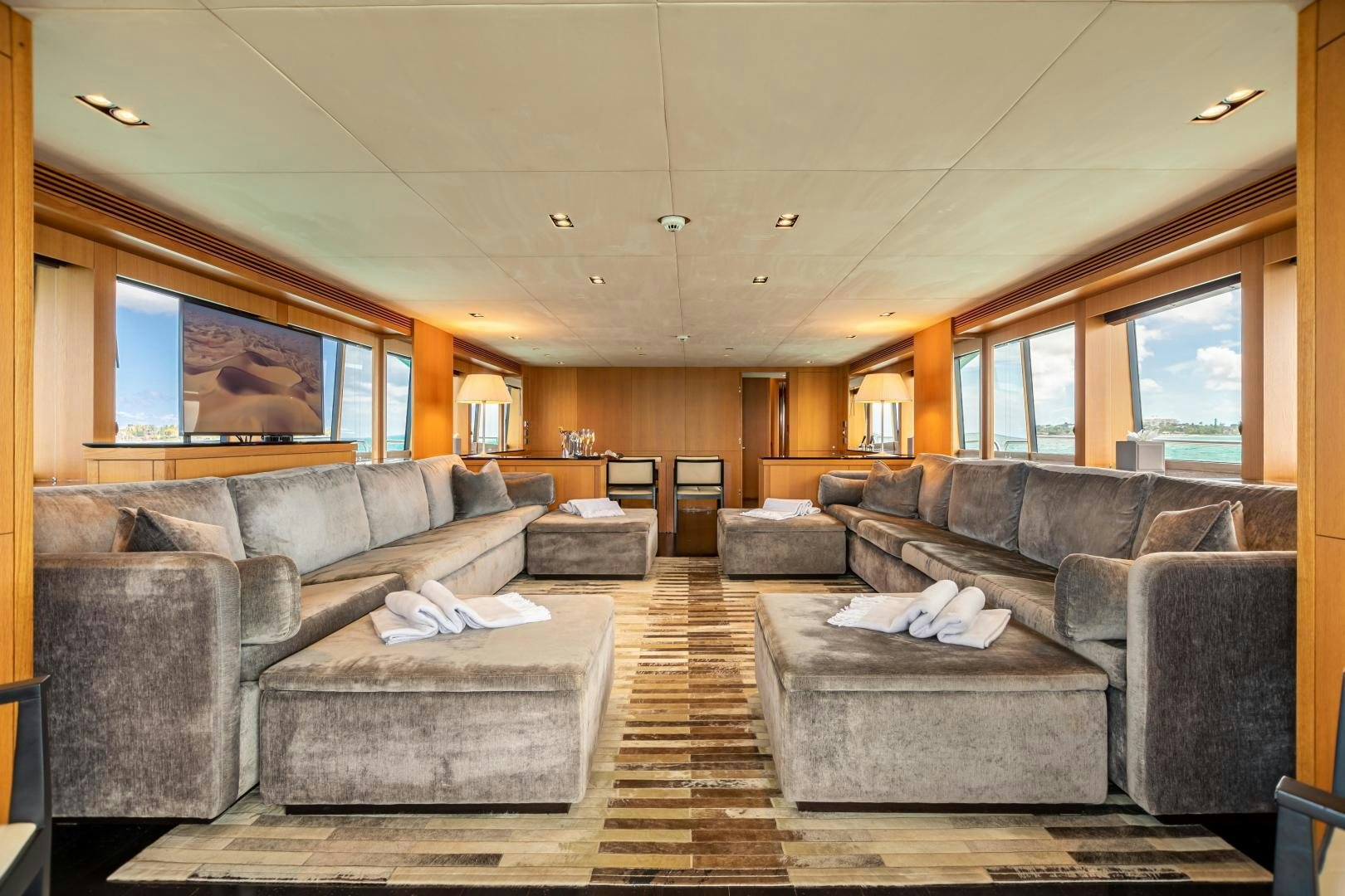 a living room with leather couches aboard CORAZON Yacht for Sale