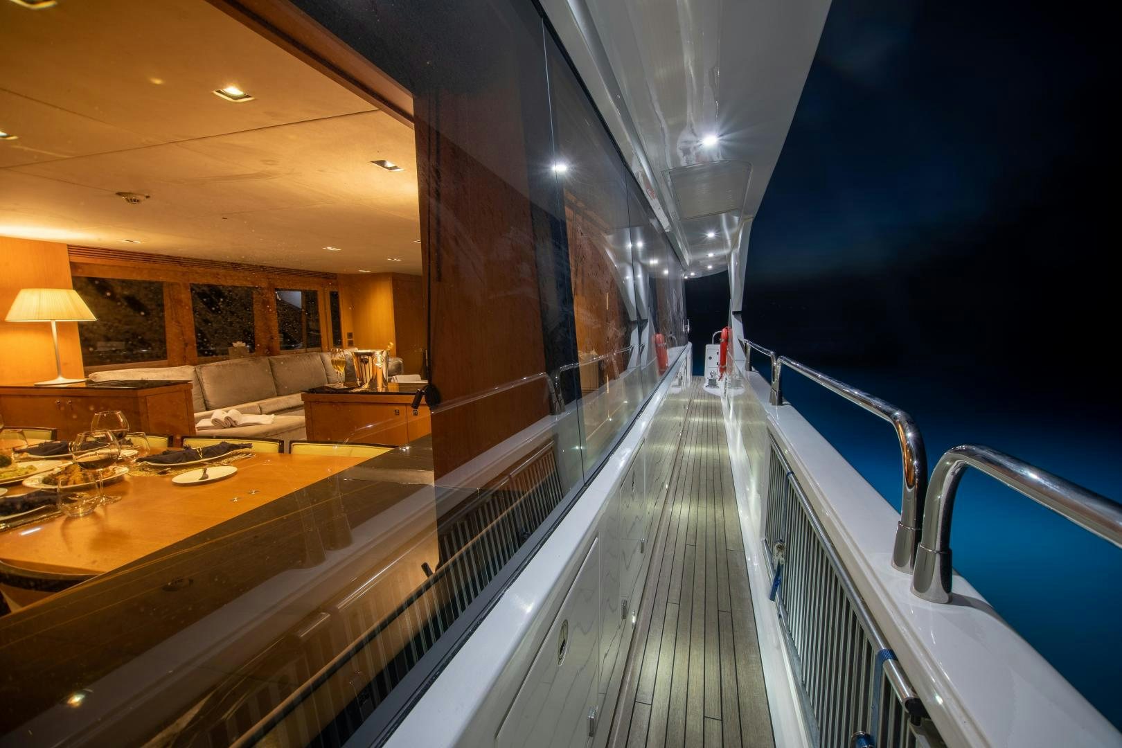 a long hallway with a balcony aboard CORAZON Yacht for Sale