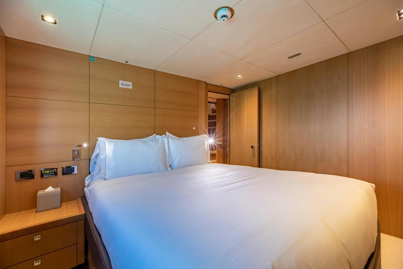 a bed in a room aboard CORAZON Yacht for Sale