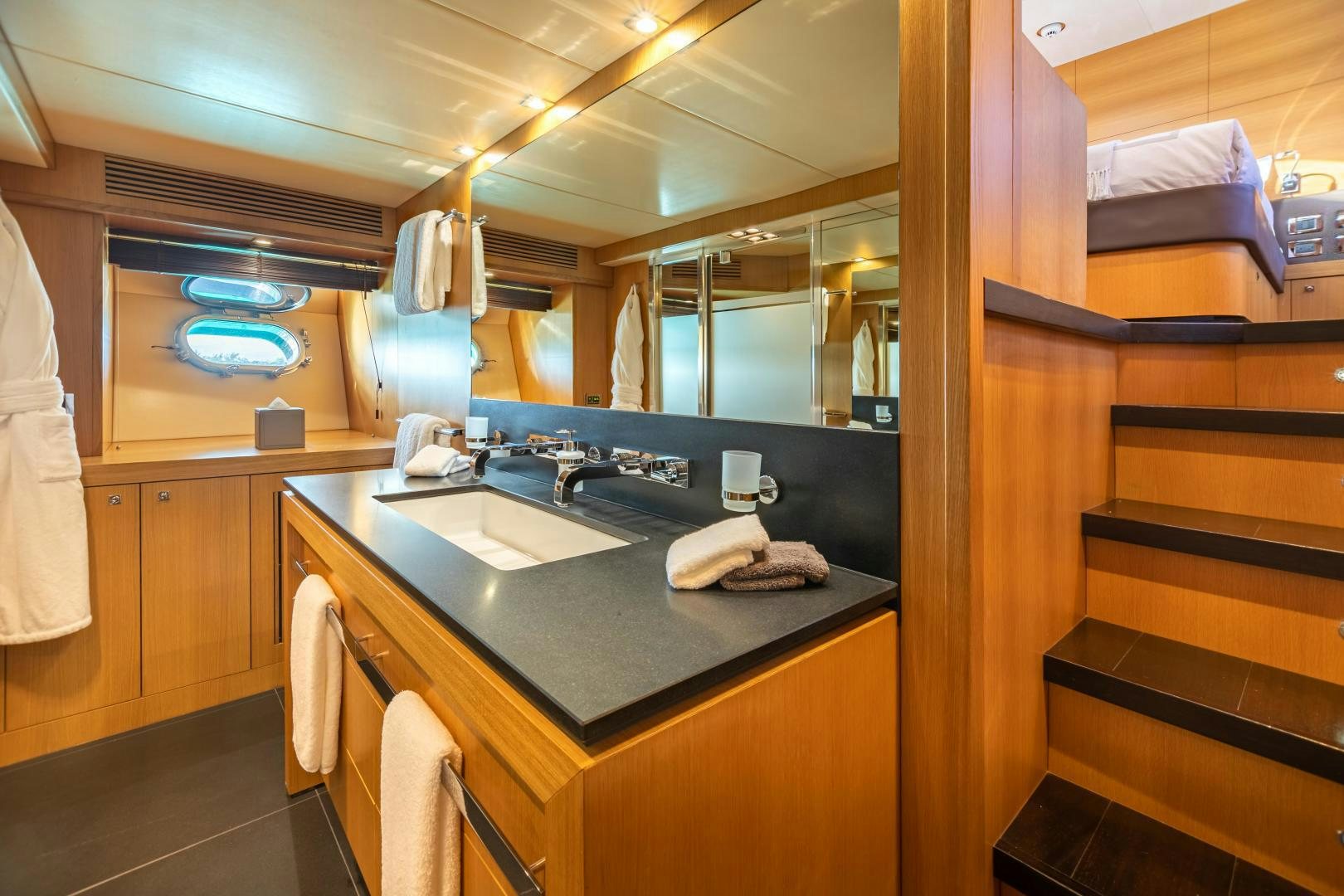 a bathroom with a large mirror aboard CORAZON Yacht for Sale