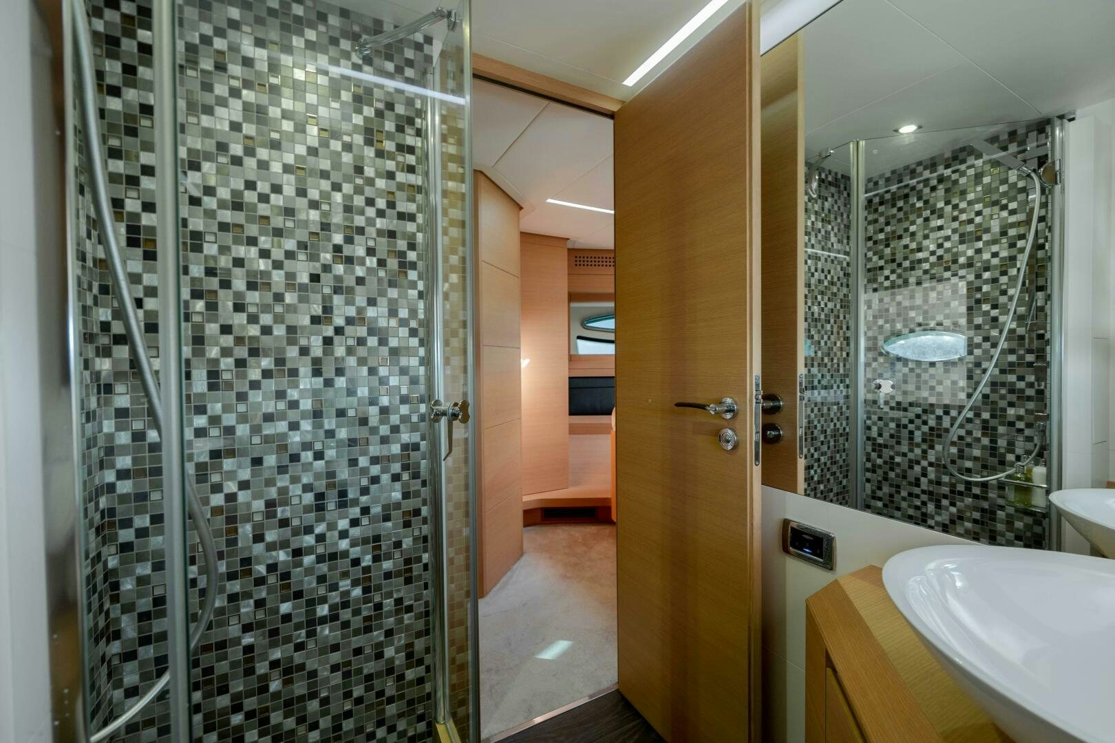 a bathroom with a glass shower aboard MILAGROS Yacht for Sale