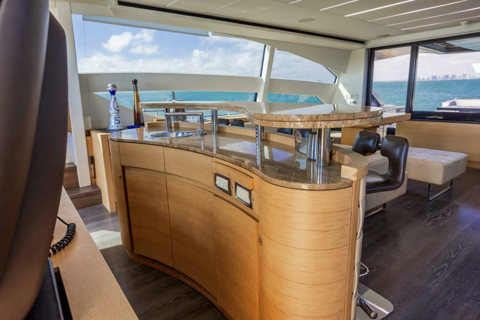 a room with a table and chairs aboard MILAGROS Yacht for Sale