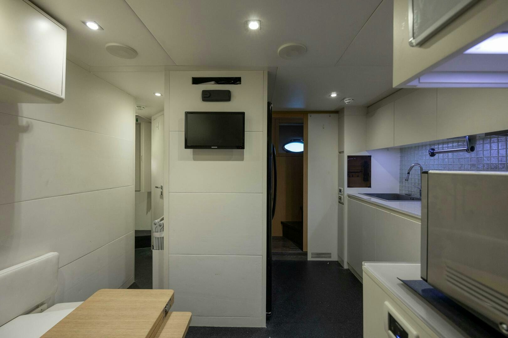 a room with a tv and a counter aboard MILAGROS Yacht for Sale
