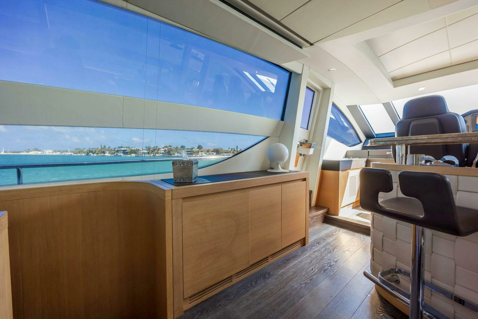 a room with a view of the water and the beach aboard MILAGROS Yacht for Sale