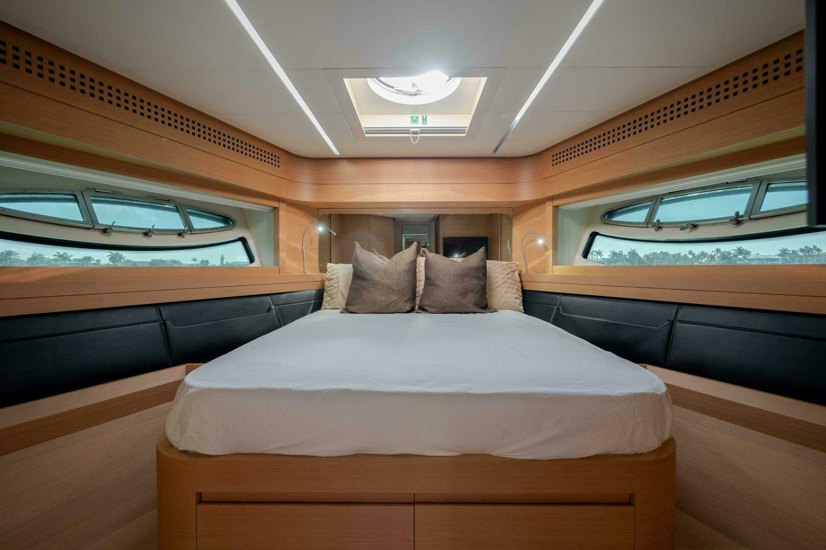 a room with a bed and a window aboard MILAGROS Yacht for Sale