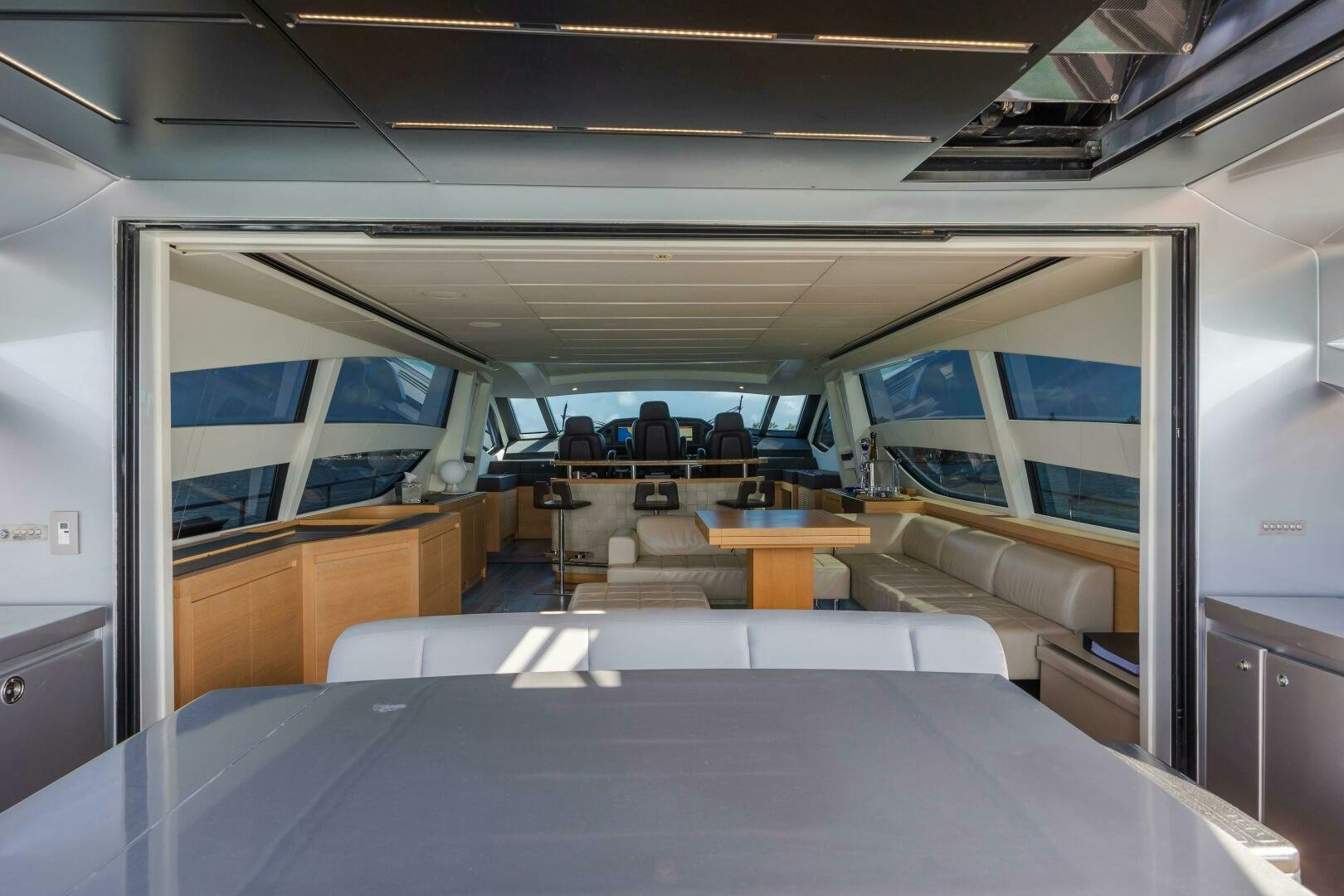 a room with a table and chairs aboard MILAGROS Yacht for Sale