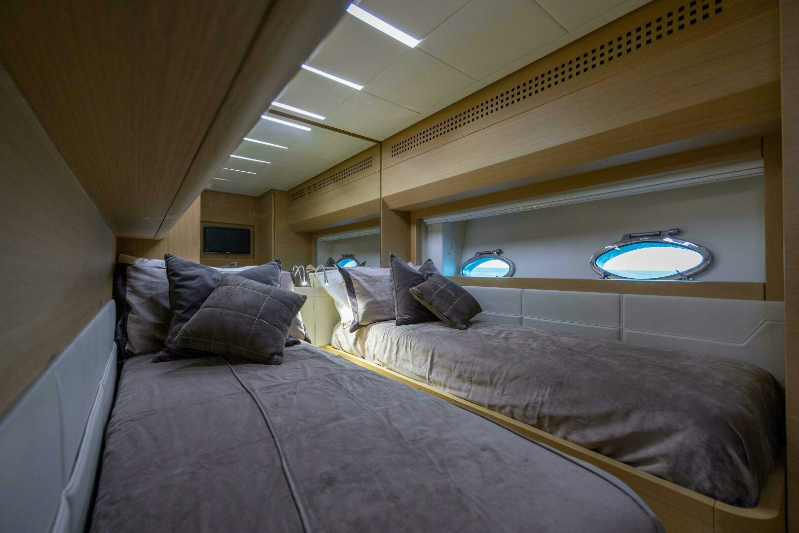 a room with a bed and a window aboard MILAGROS Yacht for Sale