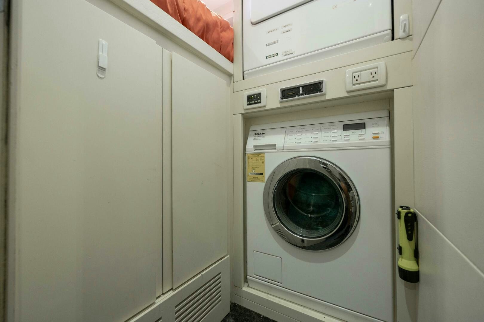 a white washing machine aboard MILAGROS Yacht for Sale