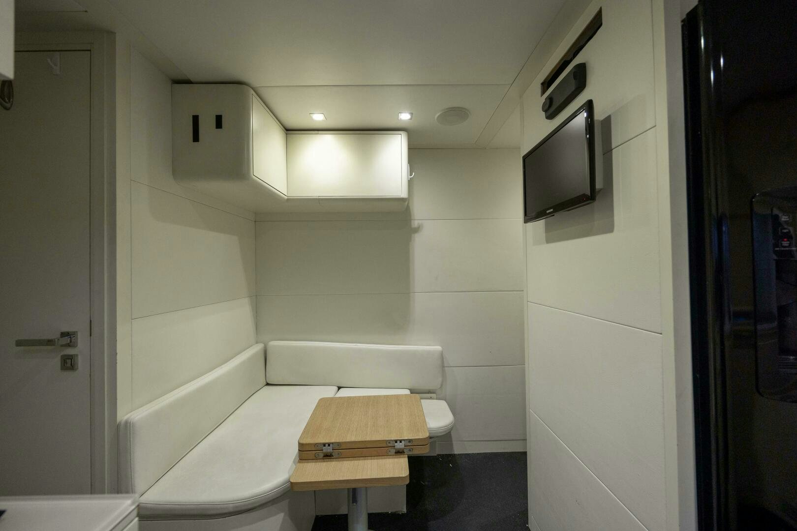 a room with a table and tv aboard MILAGROS Yacht for Sale