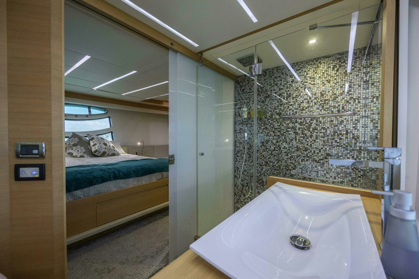 a room with a bed and a table aboard MILAGROS Yacht for Sale