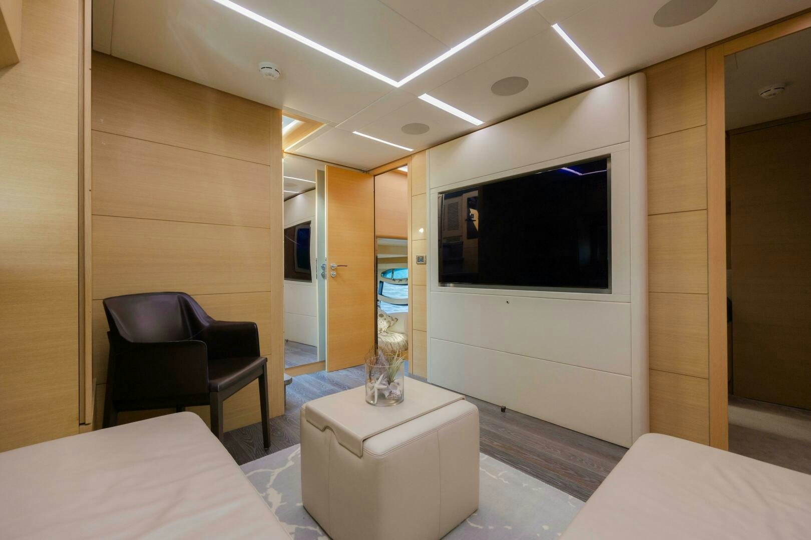 a room with a tv and a bed aboard MILAGROS Yacht for Sale