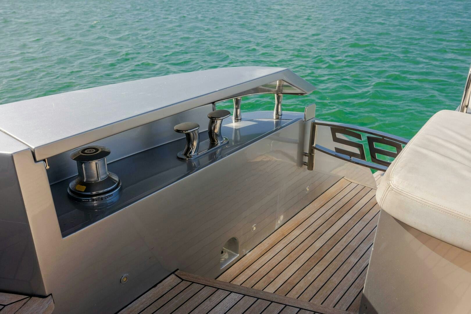 a deck with a grill and a pool aboard MILAGROS Yacht for Sale