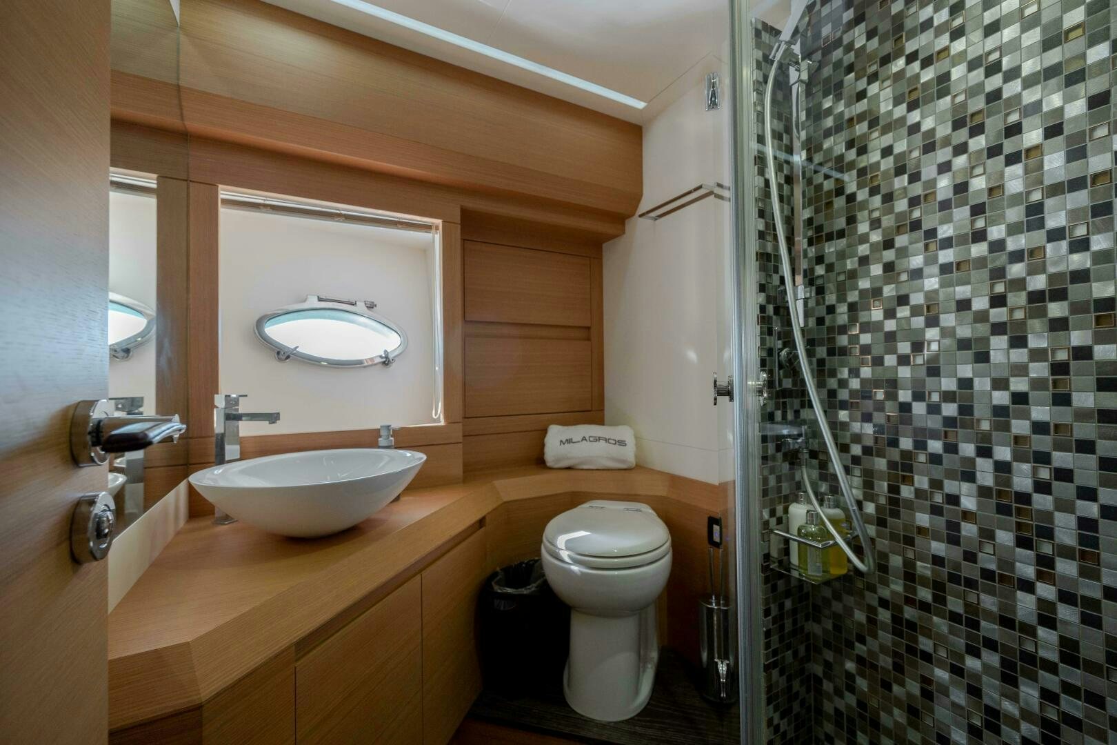 a bathroom with a sink and a toilet aboard MILAGROS Yacht for Sale