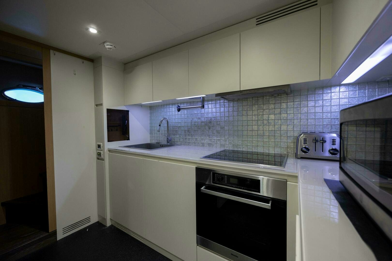 a kitchen with a stove and oven aboard MILAGROS Yacht for Sale