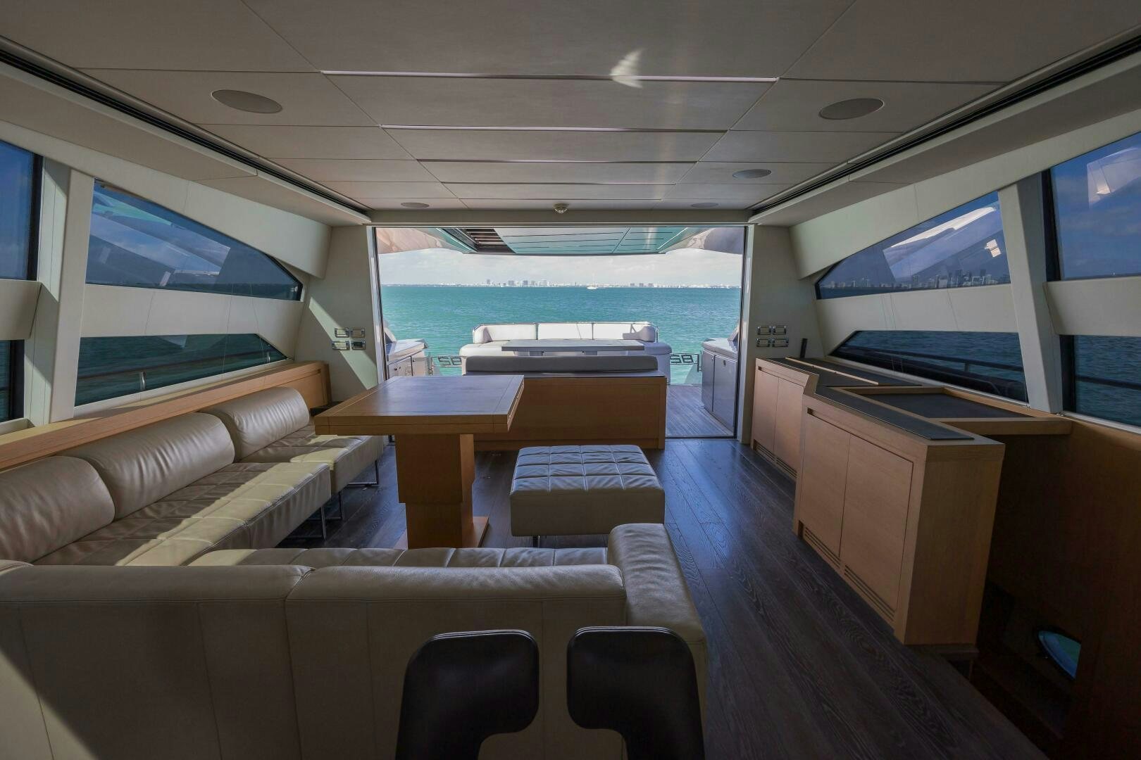 a room with a couch and a table and chairs aboard MILAGROS Yacht for Sale