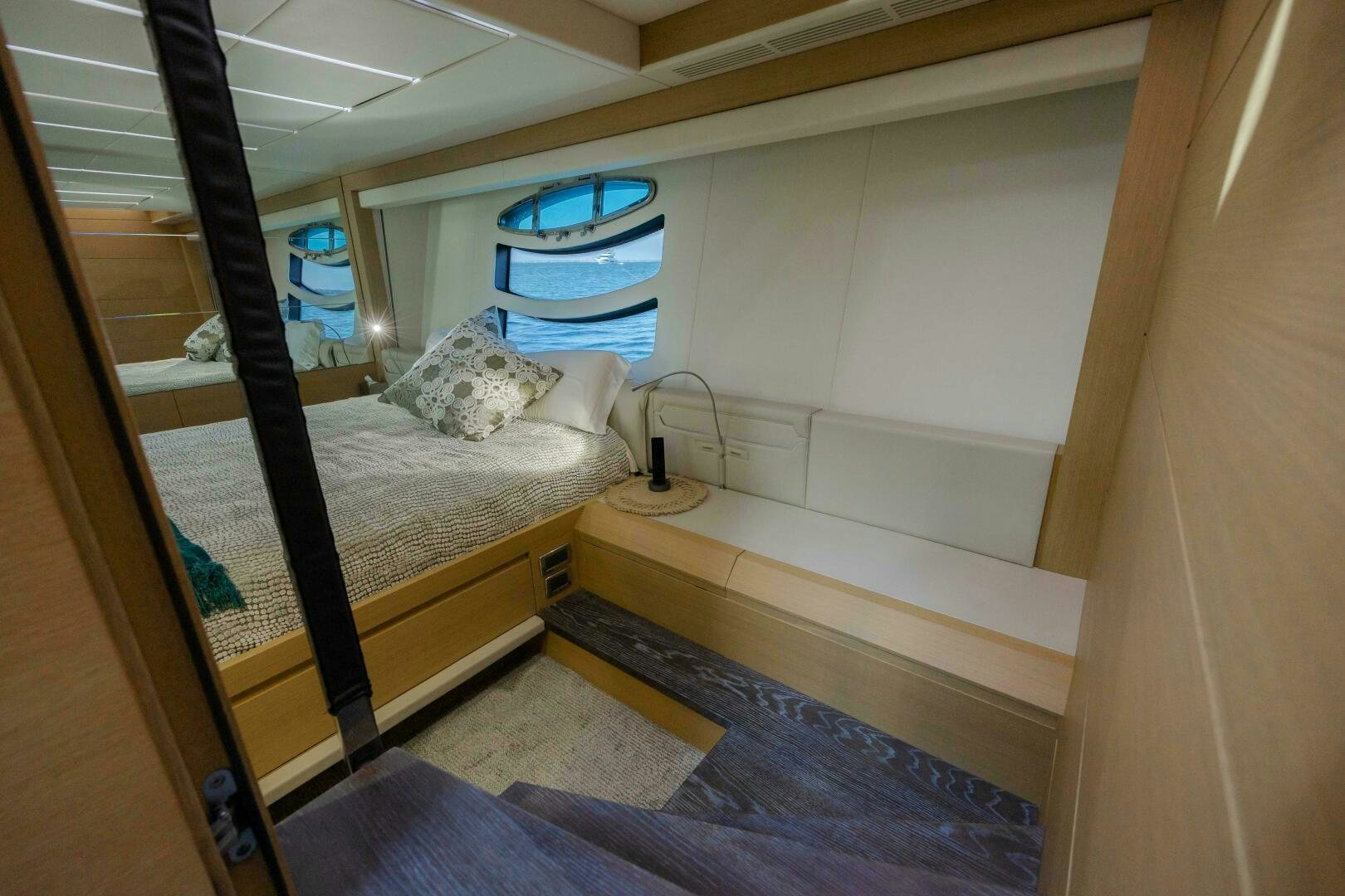 a room with a bed and a window aboard MILAGROS Yacht for Sale