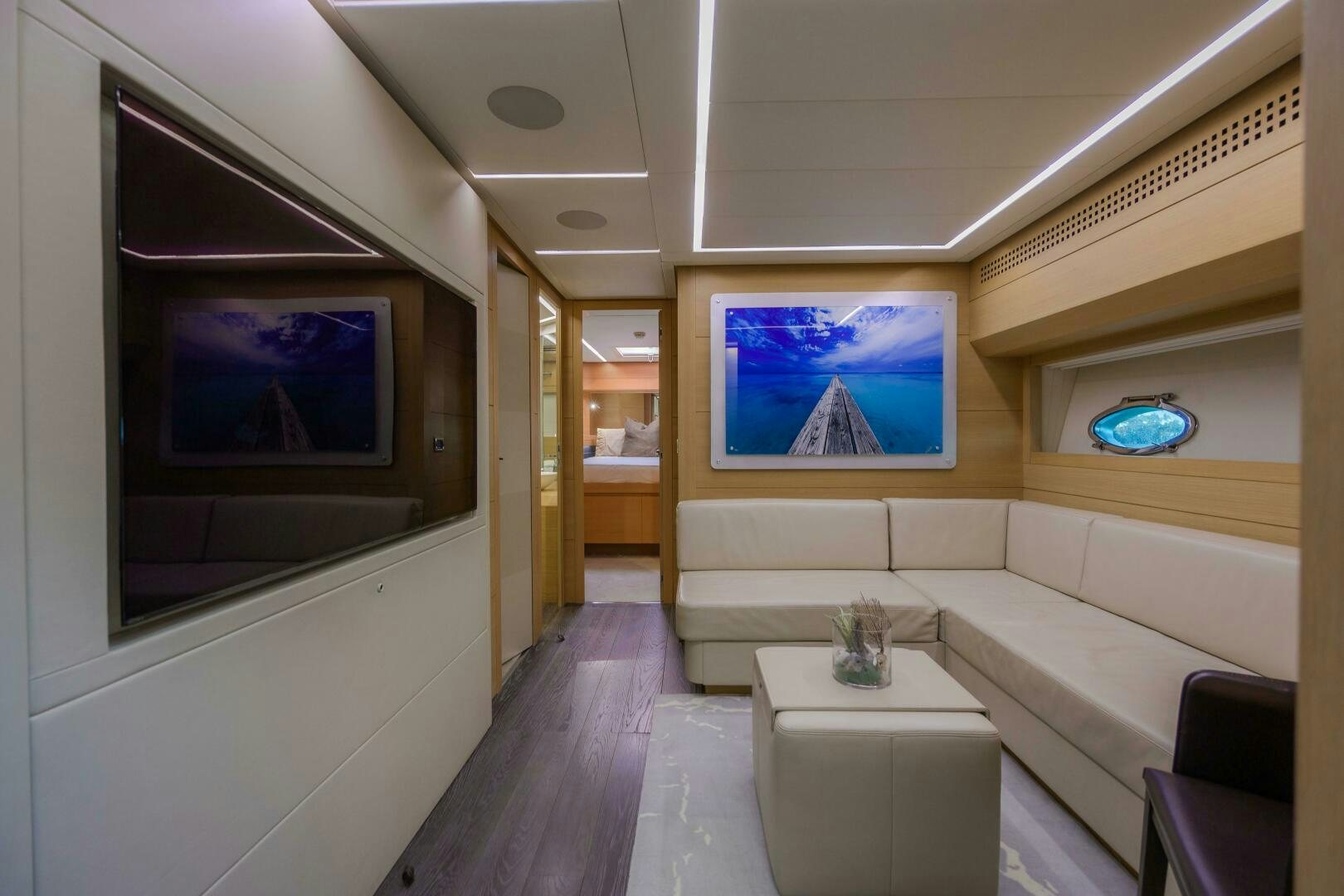 a room with a couch and a table aboard MILAGROS Yacht for Sale