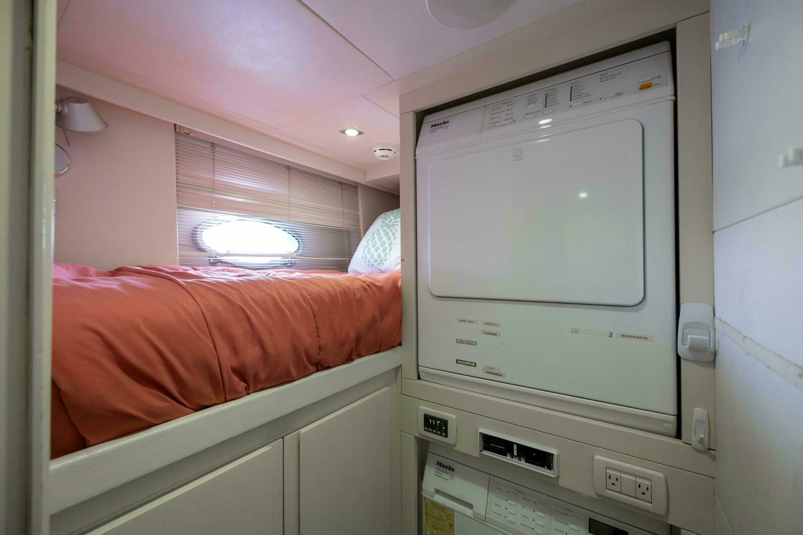 a room with a bed and a television aboard MILAGROS Yacht for Sale