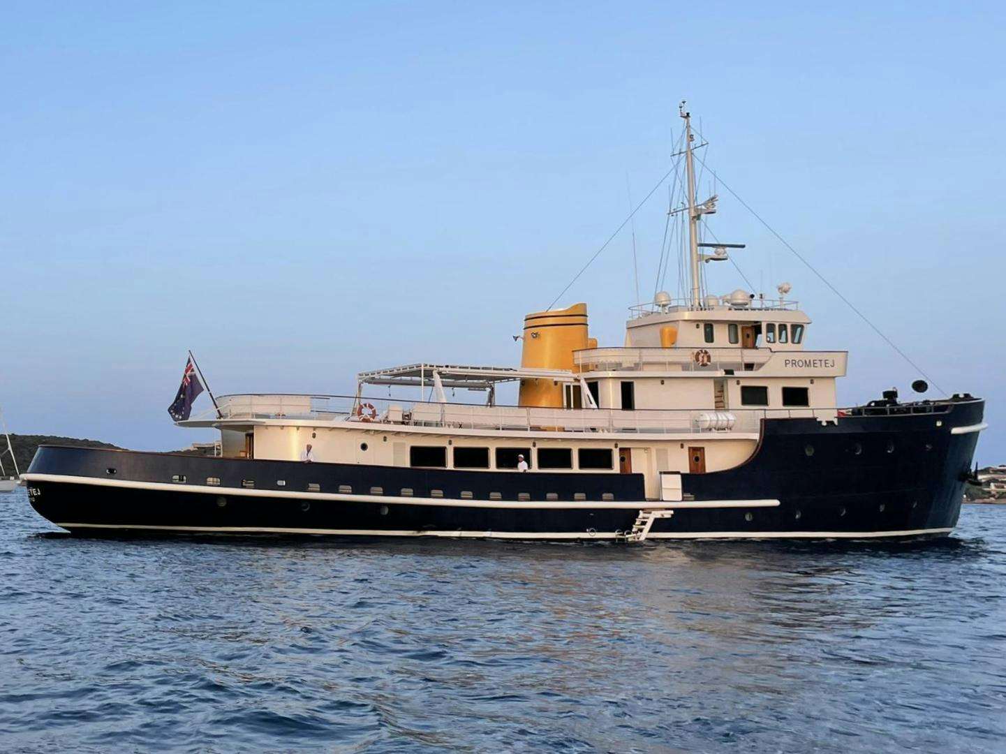 a large ship in the water aboard PROMETEJ Yacht for Sale