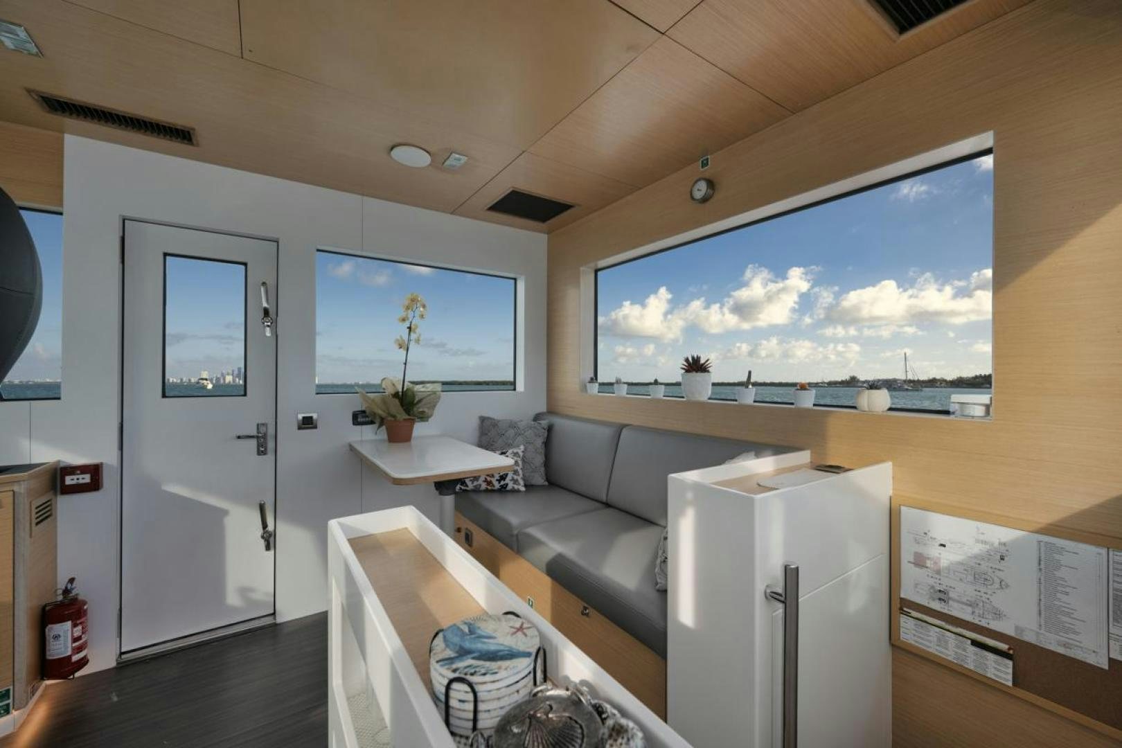 a living room with a large screen aboard NANAN SHADOW Yacht for Sale