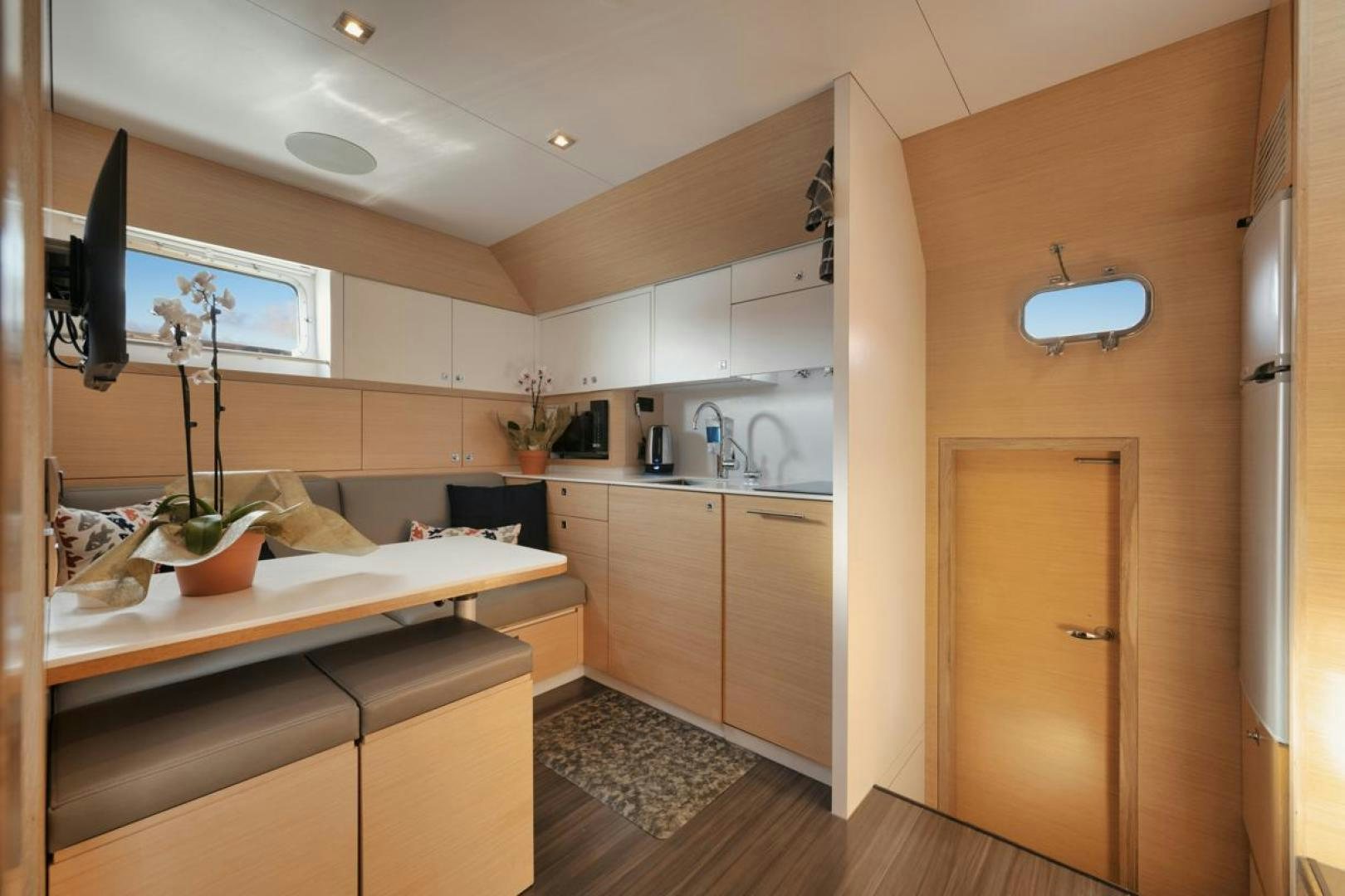 a kitchen with a large island aboard NANAN SHADOW Yacht for Sale