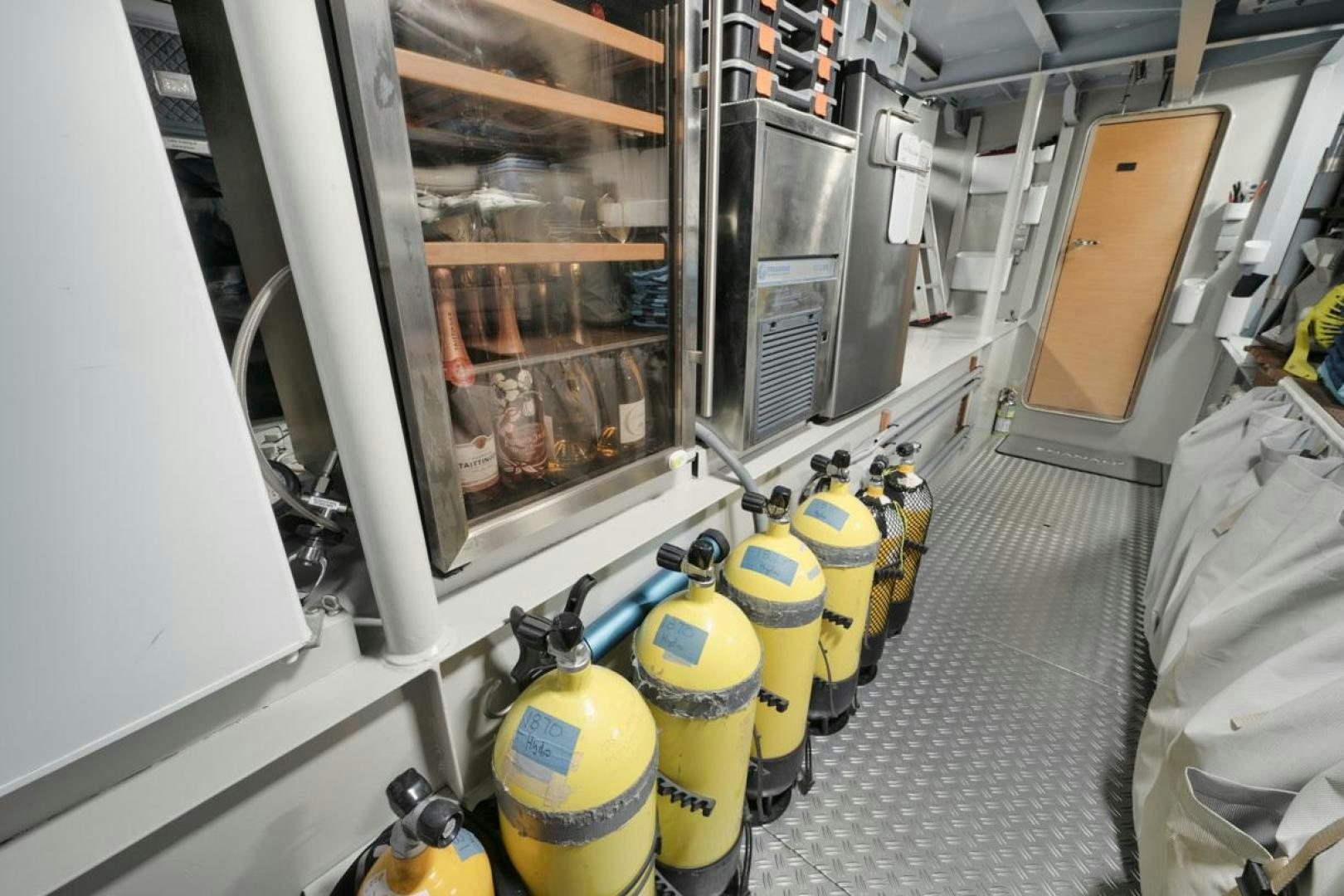 a store with a yellow jug and yellow jugs aboard NANAN SHADOW Yacht for Sale