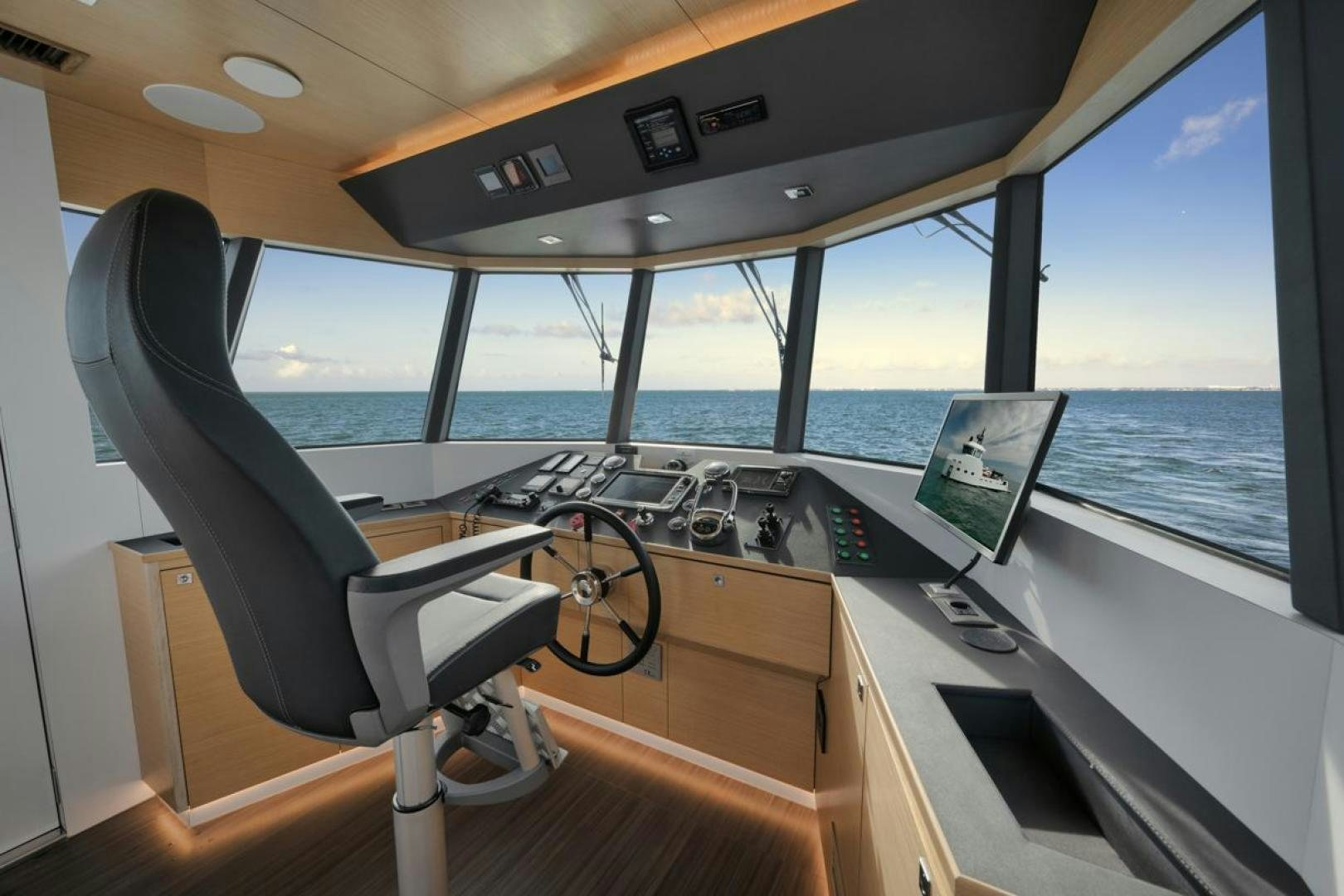 a boat with a desk and a computer on it aboard NANAN SHADOW Yacht for Sale