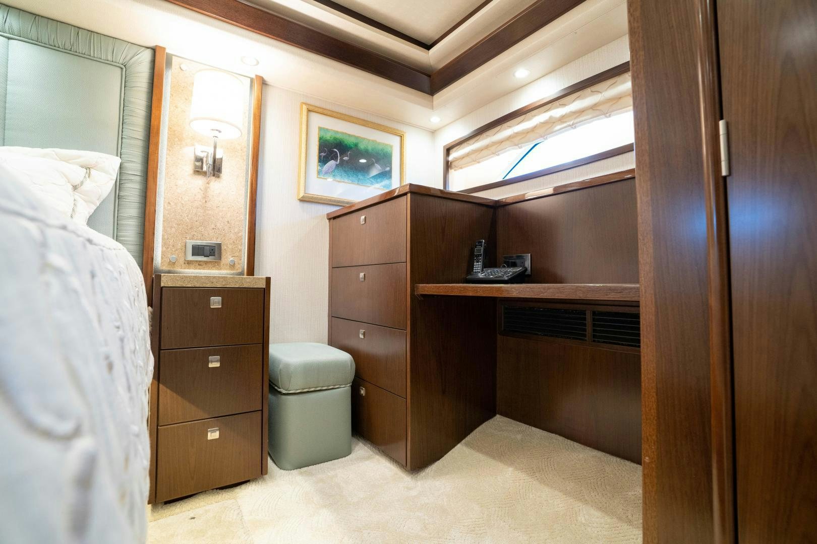a bedroom with a bed and a dresser aboard MER SEA SAKES Yacht for Sale