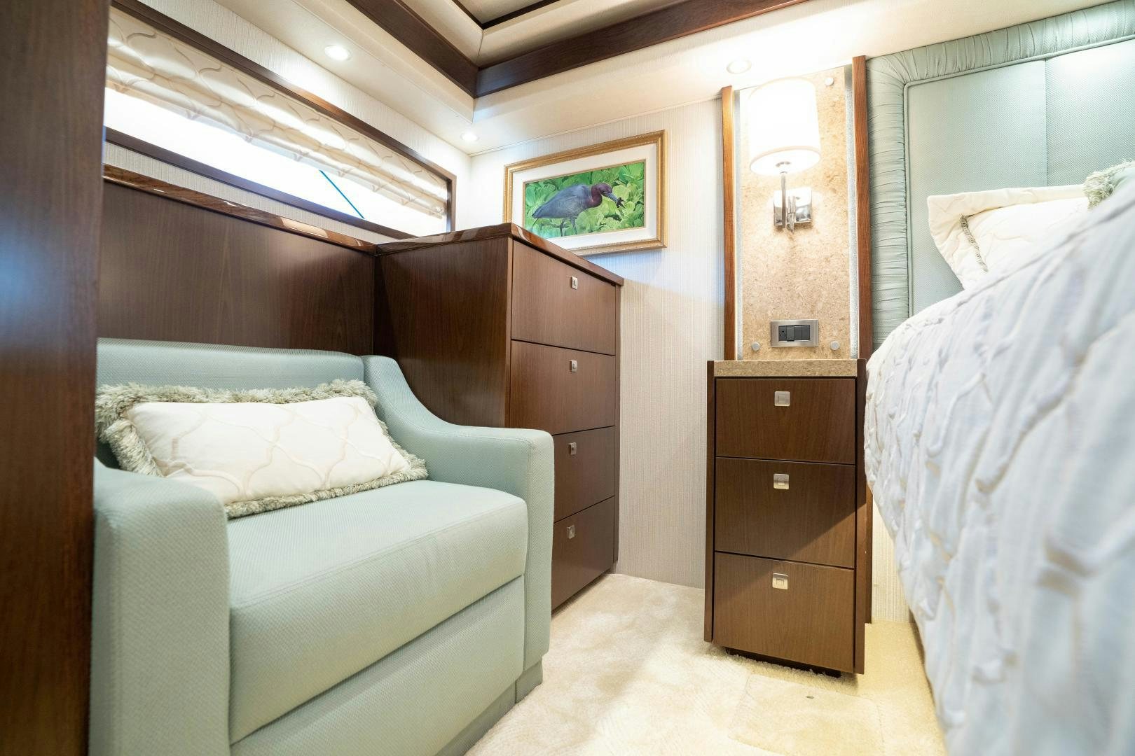 a bedroom with a bed and a dresser aboard MER SEA SAKES Yacht for Sale