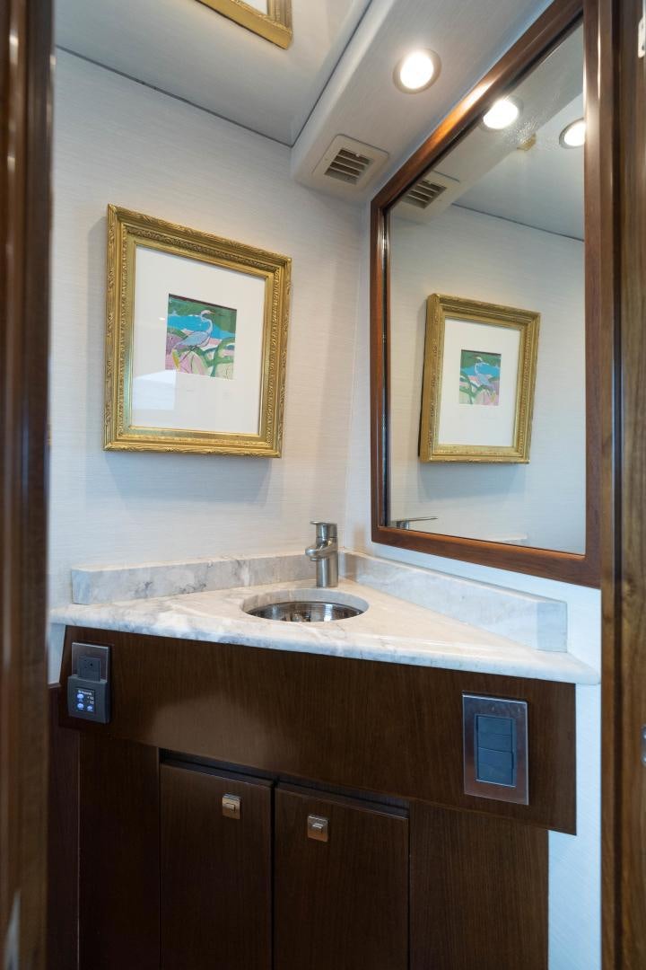 a bathroom with a sink and a mirror aboard MER SEA SAKES Yacht for Sale