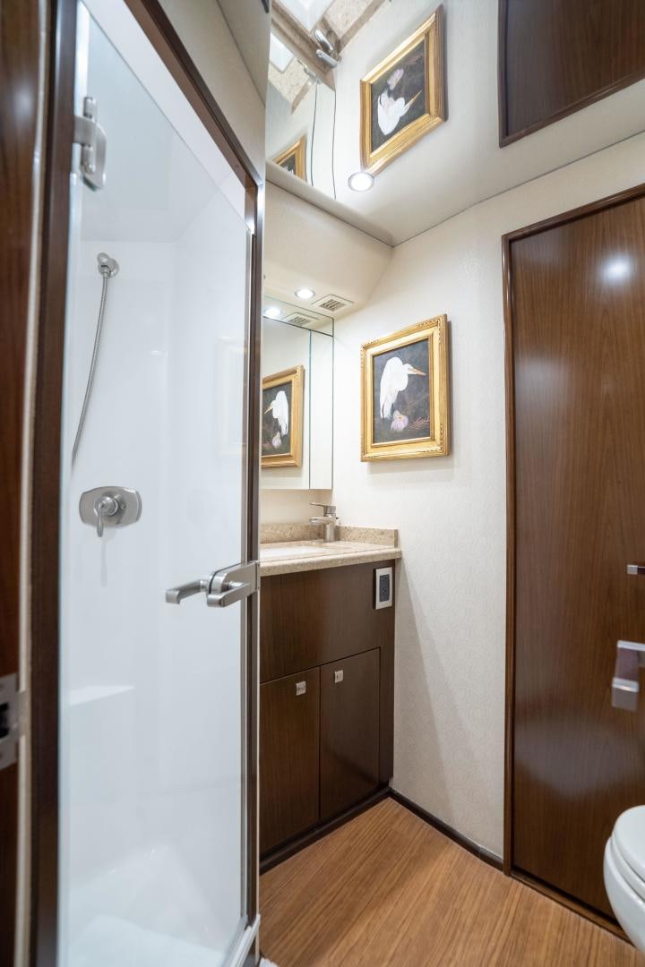 a bathroom with a shower unit and sink aboard MER SEA SAKES Yacht for Sale