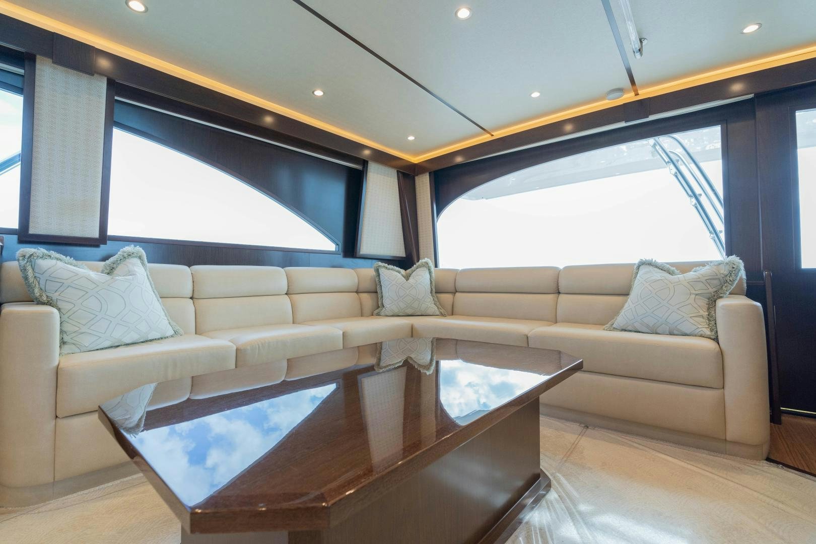 a living room with a couch and a table aboard MER SEA SAKES Yacht for Sale