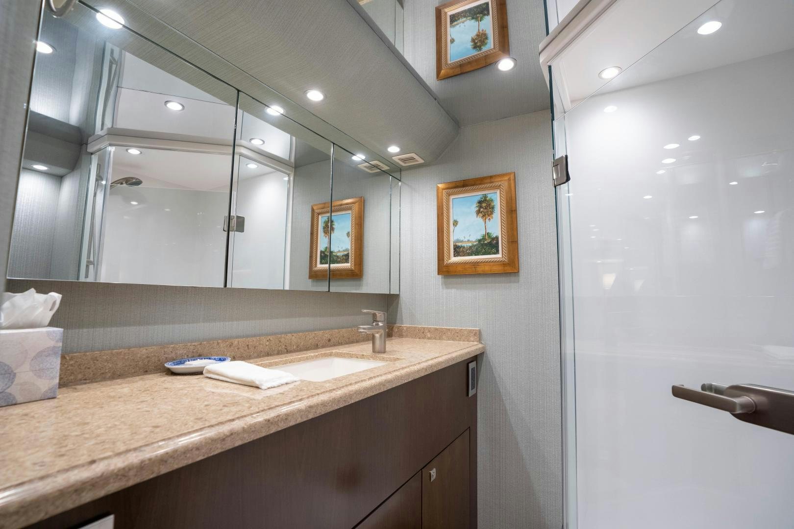 a bathroom with a countertop sink and mirror aboard MER SEA SAKES Yacht for Sale