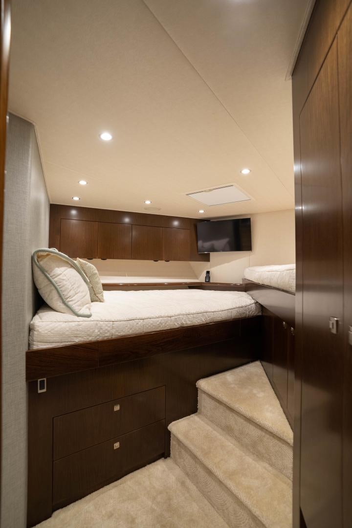 a bed with a wooden headboard aboard MER SEA SAKES Yacht for Sale