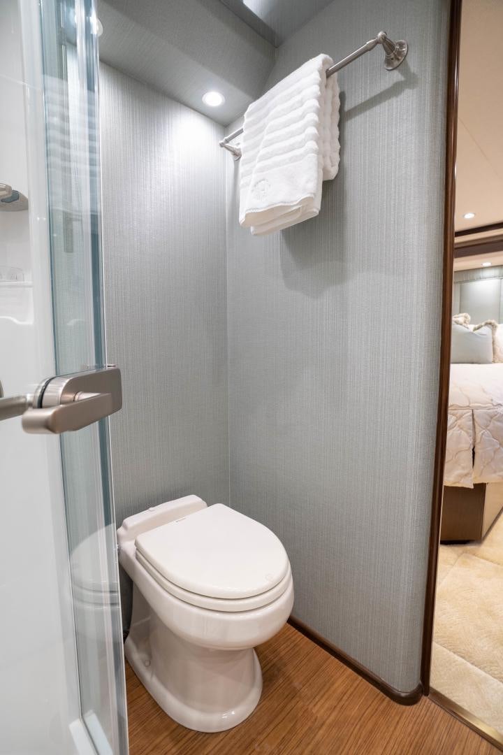 a bathroom with a toilet and a towel on the wall aboard MER SEA SAKES Yacht for Sale