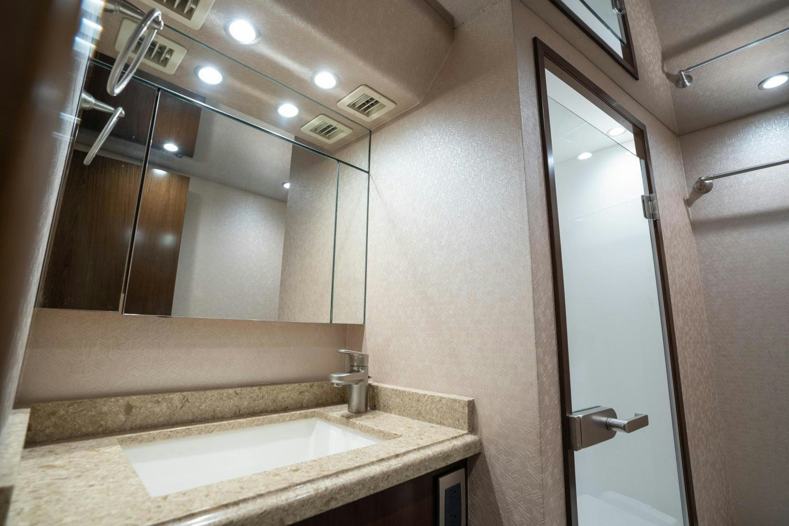a bathroom with a large mirror aboard MER SEA SAKES Yacht for Sale