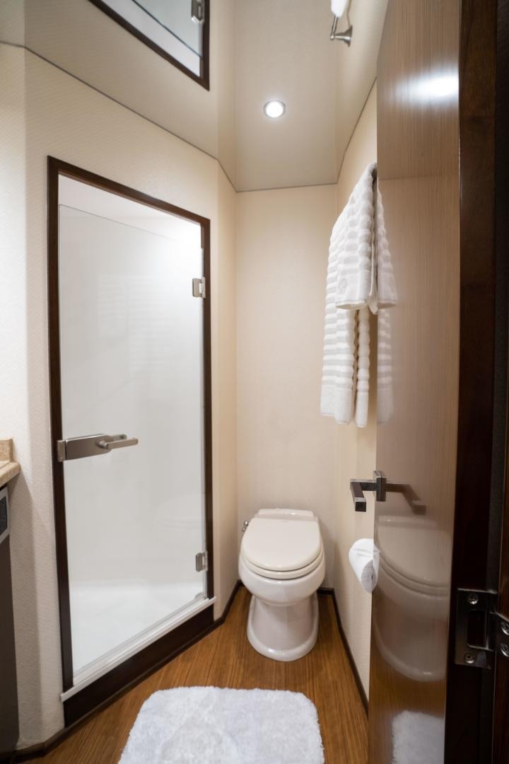 a bathroom with a toilet and a shower aboard MER SEA SAKES Yacht for Sale