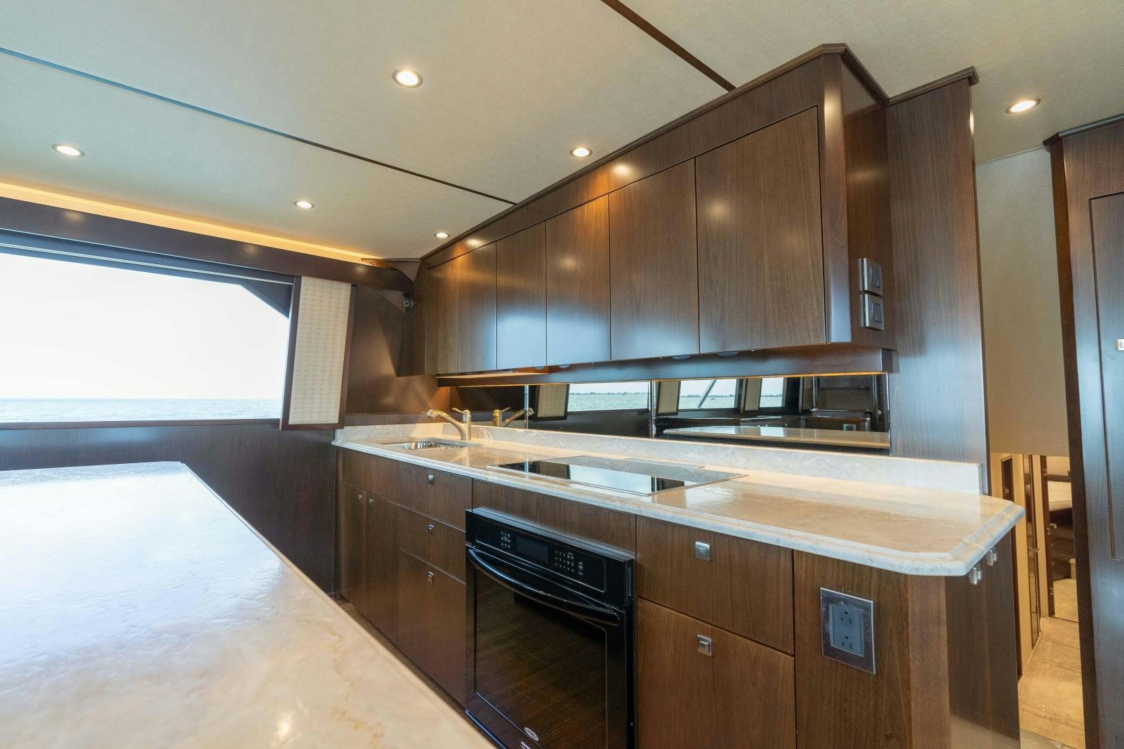 a kitchen with a stove and cabinets aboard MER SEA SAKES Yacht for Sale