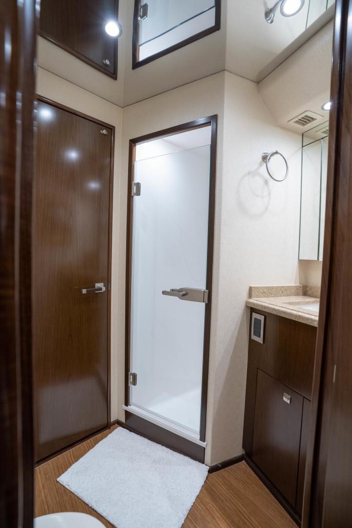a bathroom with a shower and sink aboard MER SEA SAKES Yacht for Sale