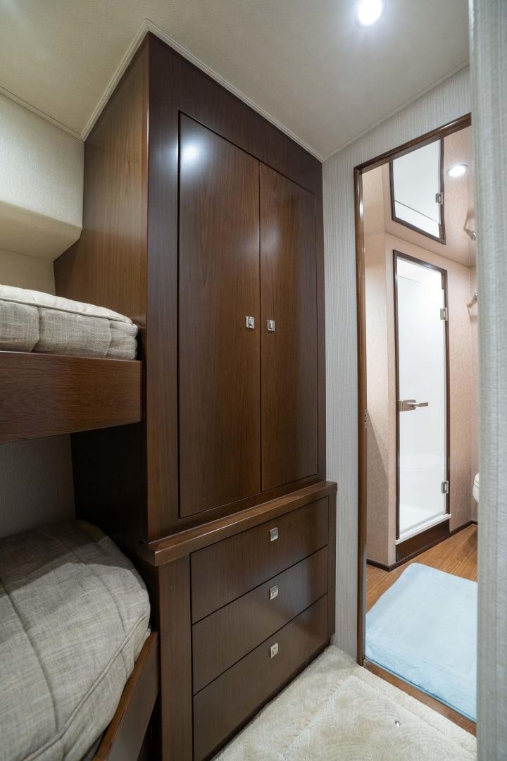 a wooden wardrobe in a bedroom aboard MER SEA SAKES Yacht for Sale