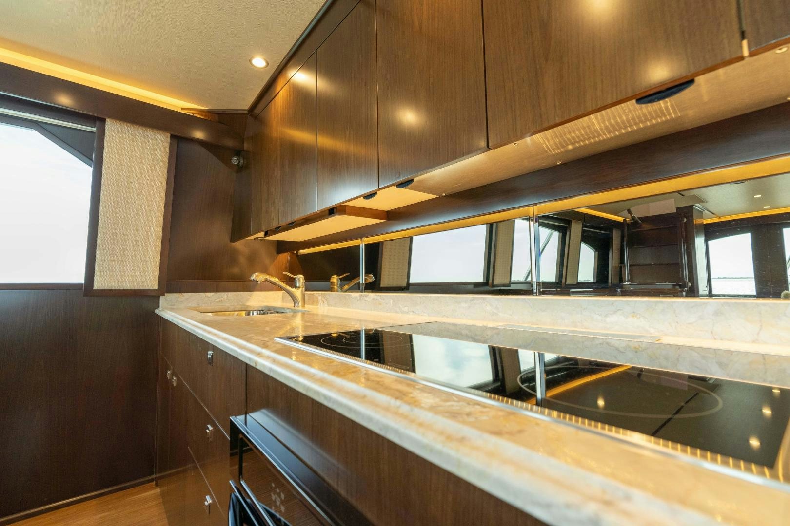 a kitchen with a large island aboard MER SEA SAKES Yacht for Sale