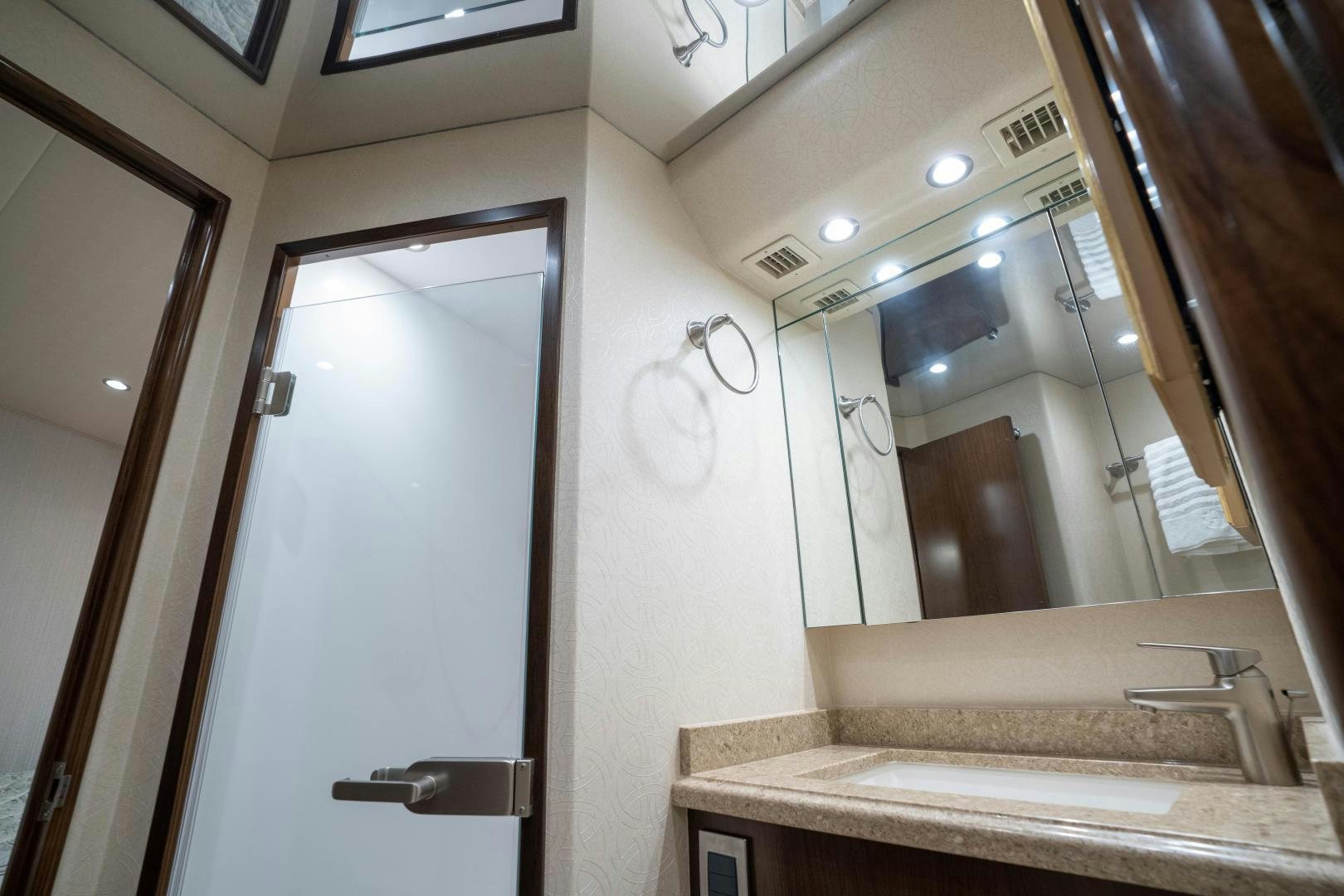 a bathroom with a large mirror aboard MER SEA SAKES Yacht for Sale