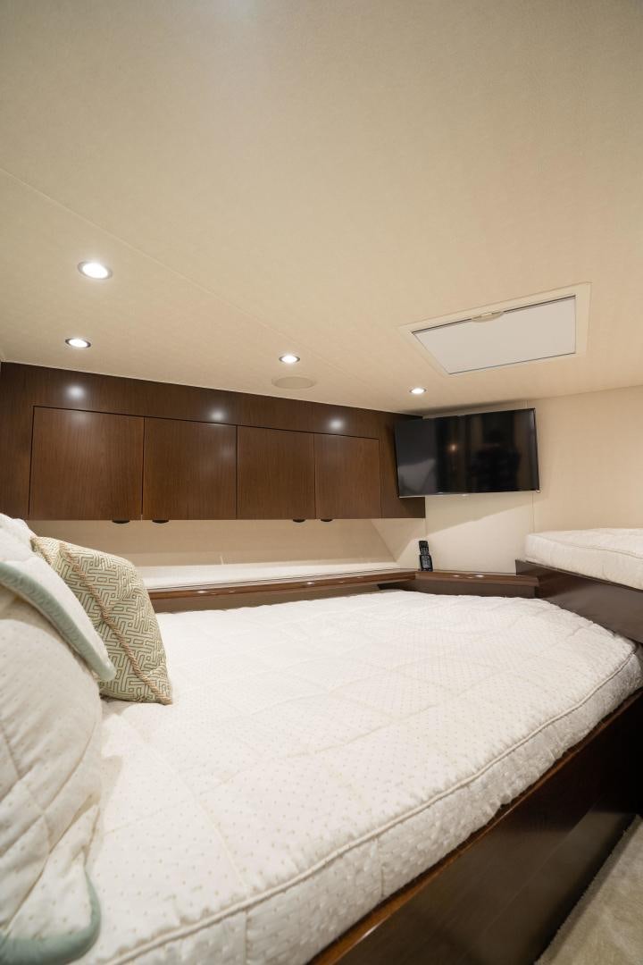 a room with a bed and a television aboard MER SEA SAKES Yacht for Sale