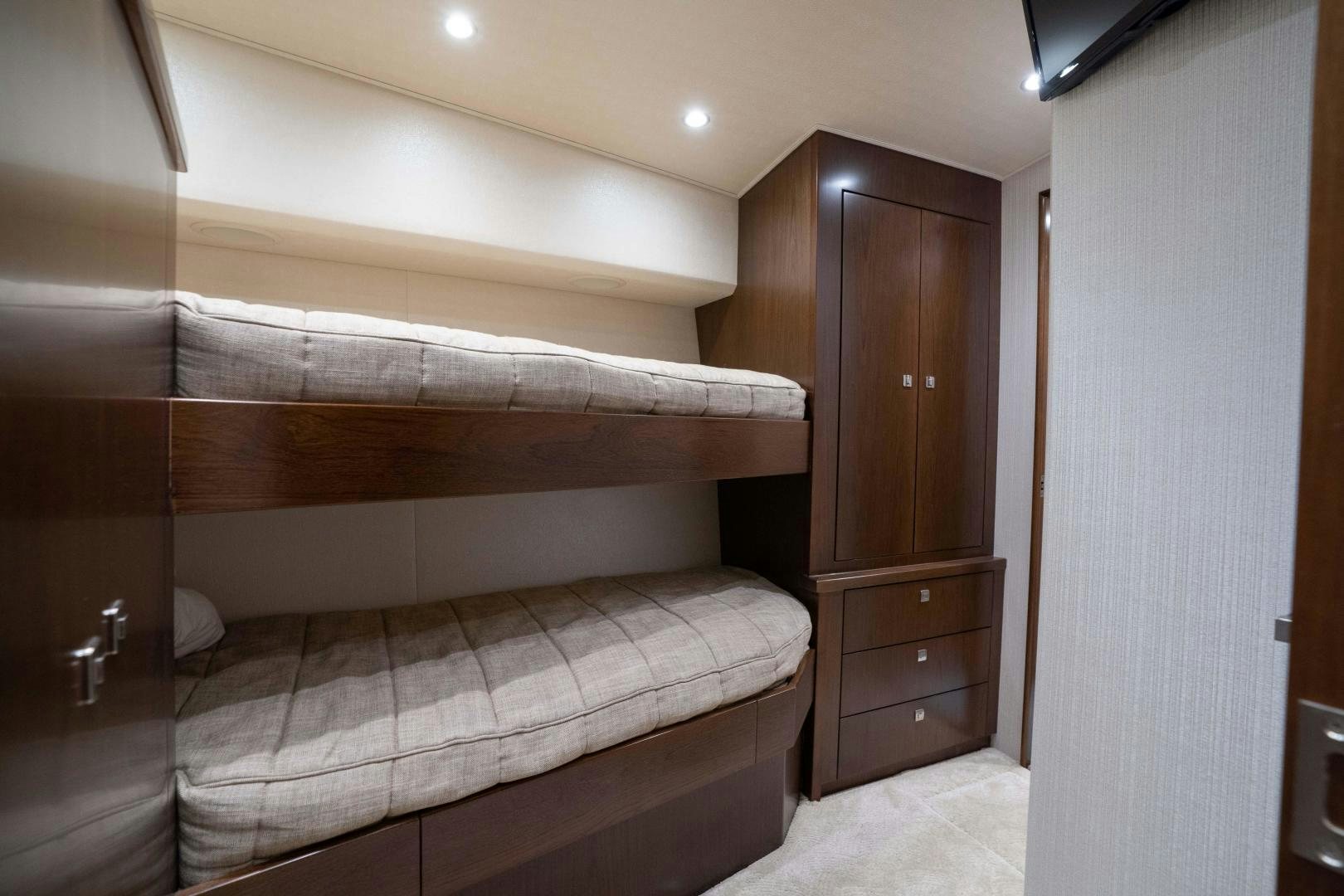 a bed with a wooden headboard aboard MER SEA SAKES Yacht for Sale