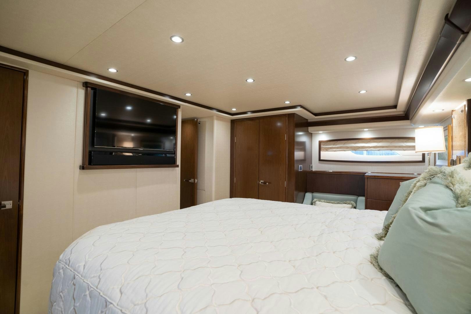a bedroom with a bed and a television aboard MER SEA SAKES Yacht for Sale