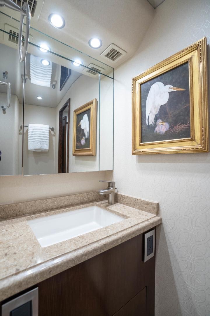 a bathroom with a mirror and a sink aboard MER SEA SAKES Yacht for Sale