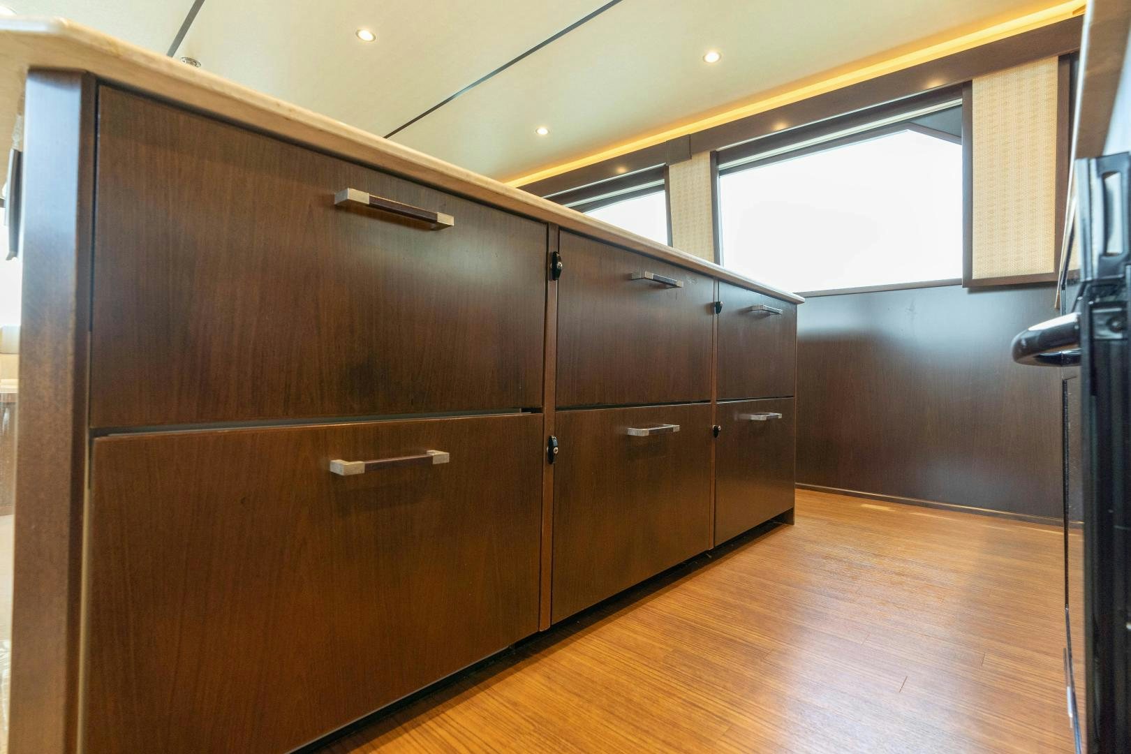 a large wooden cabinet in a room aboard MER SEA SAKES Yacht for Sale