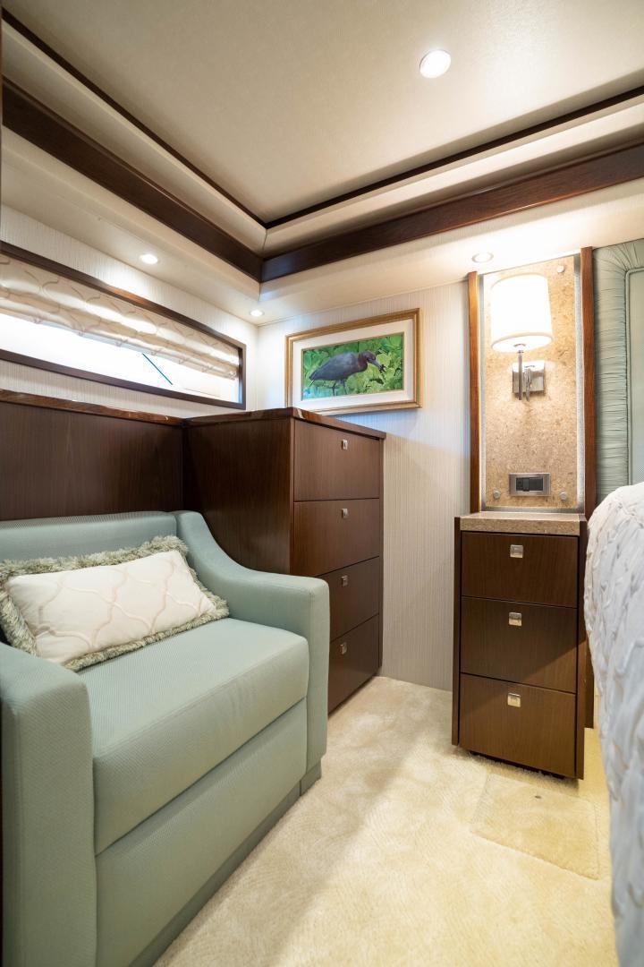 a room with a couch and a mirror aboard MER SEA SAKES Yacht for Sale