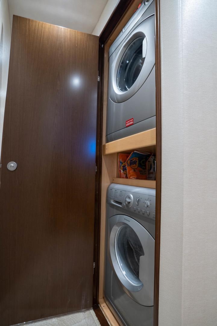 a washer and dryer in a room aboard MER SEA SAKES Yacht for Sale