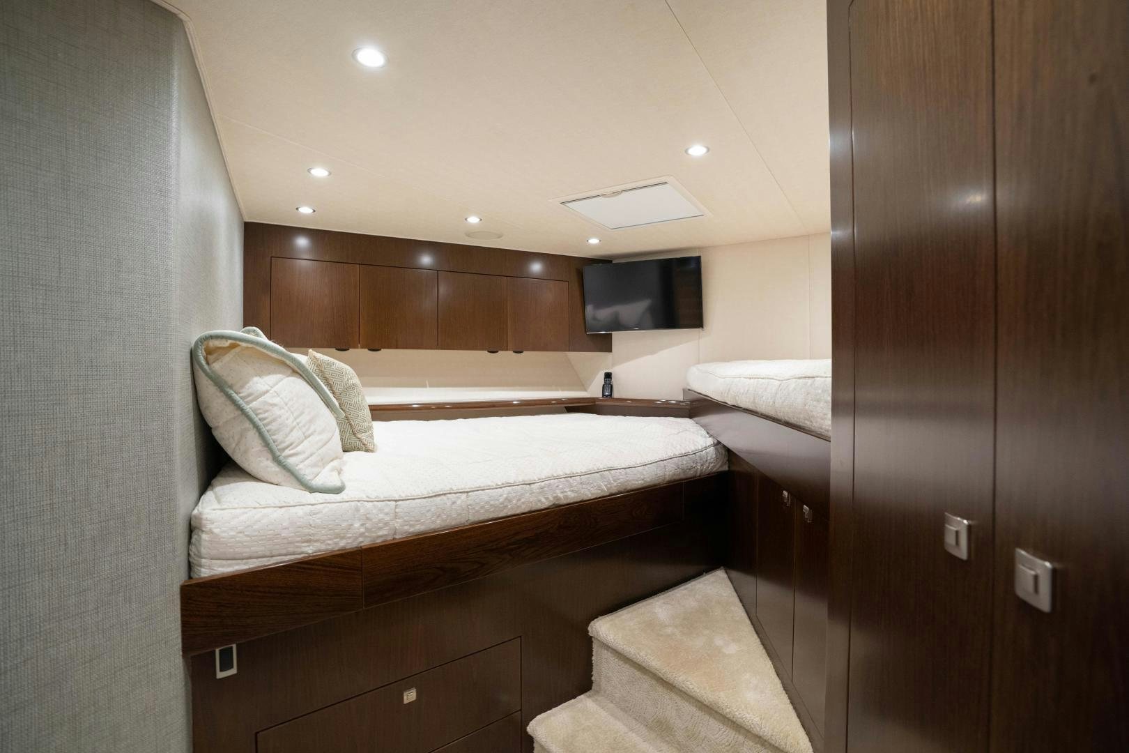 a room with a bed and a television aboard MER SEA SAKES Yacht for Sale